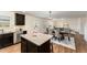 Open-concept kitchen with a granite island, perfect for cooking and entertaining at 2530 Girvan Dr, Fuquay Varina, NC 27526