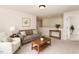 Living room features neutral walls, carpeted floor and stylish furniture at 2530 Girvan Dr, Fuquay Varina, NC 27526