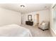 Main bedroom boasts neutral colors, plush carpet, and light-filled window at 2530 Girvan Dr, Fuquay Varina, NC 27526