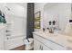Bright bathroom featuring a shower-tub combo, single sink vanity, and decorative wall art at 2810 Kempthorne Rd # 60, Cary, NC 27519