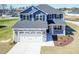 Beautiful new construction with blue siding, stone accents, and a two-car garage in a landscaped setting at 301 New Twin Br Ct, Smithfield, NC 27577