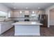 Modern kitchen features granite countertops, a center island, and stainless steel appliances at 301 New Twin Br Ct, Smithfield, NC 27577