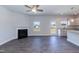 Spacious living room features a fireplace, and is adjacent to a well-lit modern kitchen at 301 New Twin Br Ct, Smithfield, NC 27577