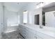 A luxurious main bathroom featuring double sinks, a soaking tub, and a separate glass shower at 301 New Twin Br Ct, Smithfield, NC 27577
