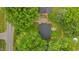This aerial view features a well maintained lawn with mature trees surrounding the home at 307 Pine Tree Rd, Oxford, NC 27565