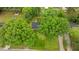 An aerial view shows this property with a tree lined lawn, mature trees, and charming homes at 307 Pine Tree Rd, Oxford, NC 27565