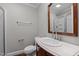 This bathroom features a wood vanity, modern fixtures, and a glass-enclosed shower at 307 Pine Tree Rd, Oxford, NC 27565