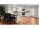 Open kitchen design with stainless steel appliances, granite countertops, and island seating at 307 Pine Tree Rd, Oxford, NC 27565