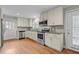 Bright kitchen featuring stainless steel appliances, granite countertops, and decorative backsplash at 307 Pine Tree Rd, Oxford, NC 27565