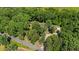 Aerial shot showing the property's location on a spacious lot surrounded by lush greenery at 3216 Green Valley Dr, Sanford, NC 27330