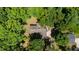Breathtaking aerial view of a home nestled in a lush, green forest setting, showcasing its privacy and natural surroundings at 3216 Green Valley Dr, Sanford, NC 27330