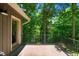 Exterior of the back porch area with a scenic view of the surrounding trees at 3216 Green Valley Dr, Sanford, NC 27330