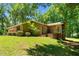 View of the screened porch overlooking the home's lush, green backyard at 3216 Green Valley Dr, Sanford, NC 27330