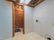 Basement laundry area with patterned wallpaper and vintage wall hookups at 3216 Green Valley Dr, Sanford, NC 27330