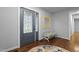 Bright foyer with elegant front door, decorative mirror, bench, and hardwood floors at 3216 Green Valley Dr, Sanford, NC 27330