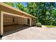 Spacious garage includes plenty of parking space and exterior stairs at 3216 Green Valley Dr, Sanford, NC 27330