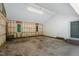 Spacious garage with exposed studs, bright lighting, and plenty of room for storage and projects at 3216 Green Valley Dr, Sanford, NC 27330
