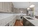 Modern kitchen with white subway tiles, granite countertops, stainless steel appliances, and a center island at 3216 Green Valley Dr, Sanford, NC 27330