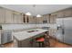 Modern kitchen featuring granite countertops, stainless steel appliances, and a center island with seating at 3216 Green Valley Dr, Sanford, NC 27330