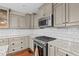 Well-equipped kitchen with ample counter space, stainless steel appliances, and subway tile backsplash at 3216 Green Valley Dr, Sanford, NC 27330