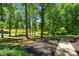 Landscaped yard featuring beautiful flower beds and a well-manicured lawn at 3216 Green Valley Dr, Sanford, NC 27330