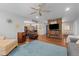 Cozy living room featuring a stone fireplace, hardwood floors, and comfortable seating at 3216 Green Valley Dr, Sanford, NC 27330
