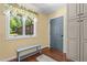 Inviting mud room features hardwood floors, bench seating, and natural light with a view of the outdoors at 3216 Green Valley Dr, Sanford, NC 27330