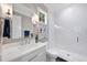 Elegant bathroom featuring marble countertop, modern fixtures, and a glass-enclosed shower at 3407 Churchill Rd, Raleigh, NC 27607
