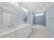 Bright bathroom with a double sink vanity, subway tile backsplash, and soaking tub at 3407 Churchill Rd, Raleigh, NC 27607