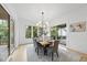 Bright dining area with natural light, seating for six, and patio access through sliding glass doors at 3407 Churchill Rd, Raleigh, NC 27607