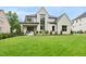 Stunning two-story home with a lush green lawn and manicured landscaping that enhances its curb appeal at 3407 Churchill Rd, Raleigh, NC 27607
