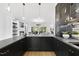 Stylish bar area with black cabinets, open to the living room for seamless entertaining at 3407 Churchill Rd, Raleigh, NC 27607
