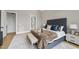Comfortable main bedroom with upholstered bed, stylish bedside tables, and a serene ambiance at 3407 Churchill Rd, Raleigh, NC 27607