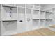 Spacious walk-in closet with custom shelving and wood floors, offering ample storage space at 3407 Churchill Rd, Raleigh, NC 27607