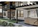 Outdoor living space with a hot tub, covered patio, and modern architectural details at 3801 Peaceful Creek Trl, Zebulon, NC 27597