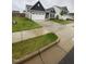 Charming home with a well-manicured lawn, concrete driveway, and a two-car garage offering curb appeal at 400 Access Dr, Youngsville, NC 27596