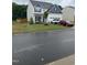 Inviting two-story home with lush lawn, tasteful landscaping, and a convenient two-car garage at 400 Access Dr, Youngsville, NC 27596