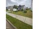 Attractive home with a green lawn, concrete driveway, and landscaping enhances the curb appeal at 400 Access Dr, Youngsville, NC 27596