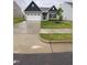 Charming single-Gathering home with a well-manicured lawn, two-car garage and stone accents at 400 Access Dr, Youngsville, NC 27596