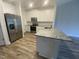 Modern kitchen with stainless steel appliances and granite countertops at 400 Access Dr, Youngsville, NC 27596