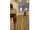 Eat-in kitchen featuring stainless steel appliances, stone countertops, and modern fixtures at 400 Access Dr, Youngsville, NC 27596