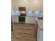 Beautiful kitchen with stainless appliances, granite counters, white cabinets, and subway tile backsplash at 400 Access Dr, Youngsville, NC 27596