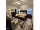 Spacious main bedroom featuring plush carpeting, a ceiling fan, a closet, and an attached bathroom at 400 Access Dr, Youngsville, NC 27596