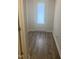 A well-lit mud room entry with new flooring and a secure, stylish glass-paneled entry door at 400 Access Dr, Youngsville, NC 27596