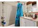 This full bathroom has a single sink vanity with granite countertops and a shower and tub combination at 4501 Zebulon Rd, Zebulon, NC 27597