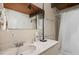 Neutral bathroom features a single sink vanity with marble countertops and a tiled shower and wood ceiling at 4501 Zebulon Rd, Zebulon, NC 27597