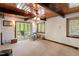 Bright bedroom with a ceiling fan and view to the wooded outdoors at 4501 Zebulon Rd, Zebulon, NC 27597