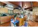 Bright kitchen featuring wooden cabinetry, a breakfast bar, and modern appliances at 4501 Zebulon Rd, Zebulon, NC 27597