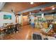 Open-concept living space with wood ceiling, a large dining table, and a kitchen with ample cabinetry at 4501 Zebulon Rd, Zebulon, NC 27597