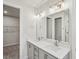 Modern bathroom features a double sink vanity, stylish lighting and ample counter space at 4607 Mint Leaf Ln, Raleigh, NC 27612